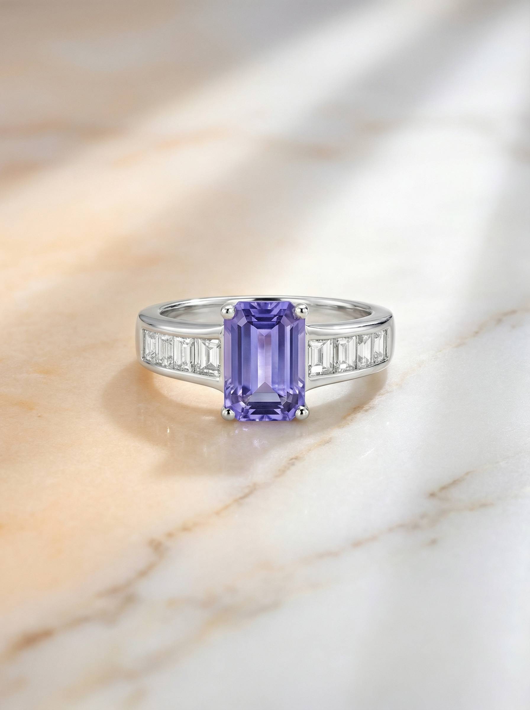 Emerald cut tanzanite ring with baguette diamond shoulders